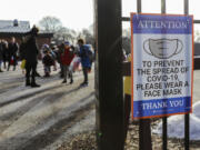 Children from kindergarten to fifth grade arrive for in-person learning at Sutherland Elementary School in Chicago on March 1, 2021, during the COVID-19 pandemic. (Jose M.