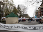 Visitors browse at the Vancouver Farmers Market on Saturday, March 26, 2022.