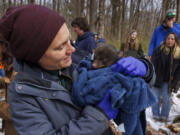 Emily Carrollo, a black bear biologist for the Pennsylvania state Game Commission, tagged and examined black bear cubs near Promised Land State Park earlier this month. (Alejandro A.