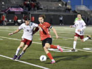 Union’s Samuel Wilson, left, defends JP Warnell of Camas during a 4A Greater St. Helens League boys soccer game on Thursday, March 30, 2023, at Doc Harris Stadium in Camas.