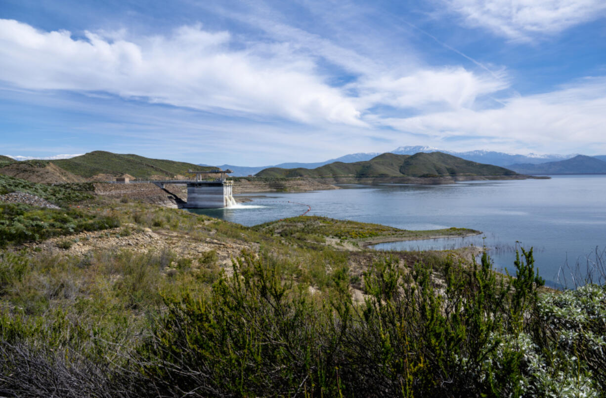 Water cascades into Diamond Valley Lake from the DVL???s inlet/outlet tower in Winchester on Monday. The Metropolitan Water District of Southern California is refilling the region???s largest reservoir with supplies made available by this winter???s storms.