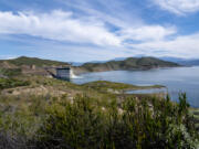 Water cascades into Diamond Valley Lake from the DVL???s inlet/outlet tower in Winchester on Monday. The Metropolitan Water District of Southern California is refilling the region???s largest reservoir with supplies made available by this winter???s storms.