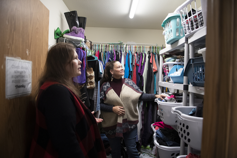 Alaire de Salvo, Janus Youth Programs shelter and outreach director, left, and case manager Robin Miller look over the clothes closet at Oak Bridge Youth Shelter. Oak Bridge, the first crisis intervention shelter of its kind in the Clark County area, serves both state-dependent and non-state-involved youth ages 9 to 17 and their families.