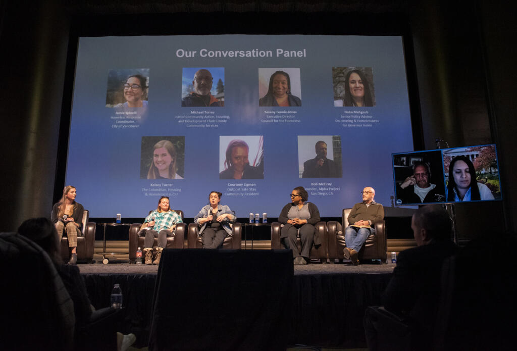 City of Vancouver homeless response coordinator Jamie Spinelli, third from left, talks to a crowd Wednesday, March 1, 2023, during the Columbian Conversations event at Kiggins Theatre. The panel of local, state and national homelessness experts talked about potential solutions to the crisis. Pictured from left: The Columbian homelessness and housing reporter Kelsey Turner, Outpost Safe Stay resident Courtney Ligman, Spinelli, Council for the Homeless executive director Sesany Fennie-Jones and Clark County Community Services project manager Michael Torres. Alpha Project founder Bob McElroy and Noha Mahgoub, senior policy advisor on housing and homelessness for Gov. Jay Inslee, appeared virtually, respectively.