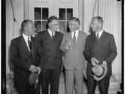 The Soviet ANT-25 transpolar flight crew, navigator Alexander Belyakov, left, pilot Valery Chkalov and co-pilot Georgi Baidukov, wait in the White House with an unknown man in 1937. Portland’s Meier & Frank department store owner exchanged three new suits with them, gaining a fur-lined flying suit for his window display. However, the Soviets declined to part with their long underwear.