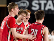 Camas senior forward Josh Dabasinskas celebrates with teammates after victory in a Class 4A State boys basketball game on Wednesday, March 1, 2023, at the Tacoma Dome.