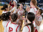 Camas celebrates its victory in a Class 4A State girls basketball semifinal on Friday, March 3, 2023, at the Tacoma Dome.