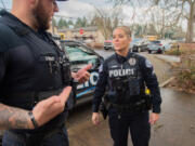 Sgt. James Kelly, left, and Cpl. Jamie Haske talk about the body-worn cameras Vancouver police officers began receiving two weeks ago. Department officials said each officer undergoes training on the agency's policy and hands-on instruction for operating the cameras prior to using the equipment.