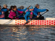 A group of NW women battling breat cancer train for dragon boat races on the Willamette River. The group will be one of several travelling to New Zealand for a dragon boating convention.