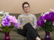 Ally Orr poses for a portrait at Orr's residence in Battle Ground. Her shirt, which she created herself, shares a campaign motto of "I stand with medicated, meddlesome and quarrelsome women." The slogan is a response to a Boise State professor's statement at a National Conservatism Conference in 2021 where he used the three adjectives to describe independent women.