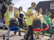 Hough Elementary School students play drums and march Friday during the Paddy Hough Parade in Vancouver.