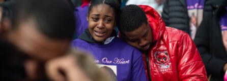 Layla Stewart's auntie, Lashay Taylor, in purple memorial shirt, grieves at a community vigil Sunday for the 7-year-old girl and her mother, Meshay Melendez, in Esther Short Park.