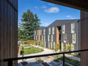 The Elwood permanent supportive housing complex has a community garden among other trauma-informed features designed by Access Architecture.