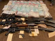 Firearms and suspected drugs, including fentanyl pills, seized in connection with a drug trafficking investigation tied to a white supremacist prison gang. A Ridgefield man was one of 27 people federally indicted in connection with the trafficking ring.