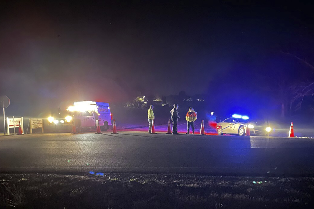 Emergency responders are seen near a site where two military helicopters crashed Wednesday night during a routine training mission in Trigg County, in southwestern Kentucky, on March 30, 2023.