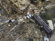 FILE - Debris is strewn about tornado-damaged homes March 26, 2023, in Rolling Fork, Miss. Meteorologists are urging people in parts of the Midwest and southern U.S. to be ready Friday, March 31, for dangerous weather including tornadoes, saying the conditions are similar to those a week ago that unleashed a devastating twister that killed at least 21 people in Mississippi.