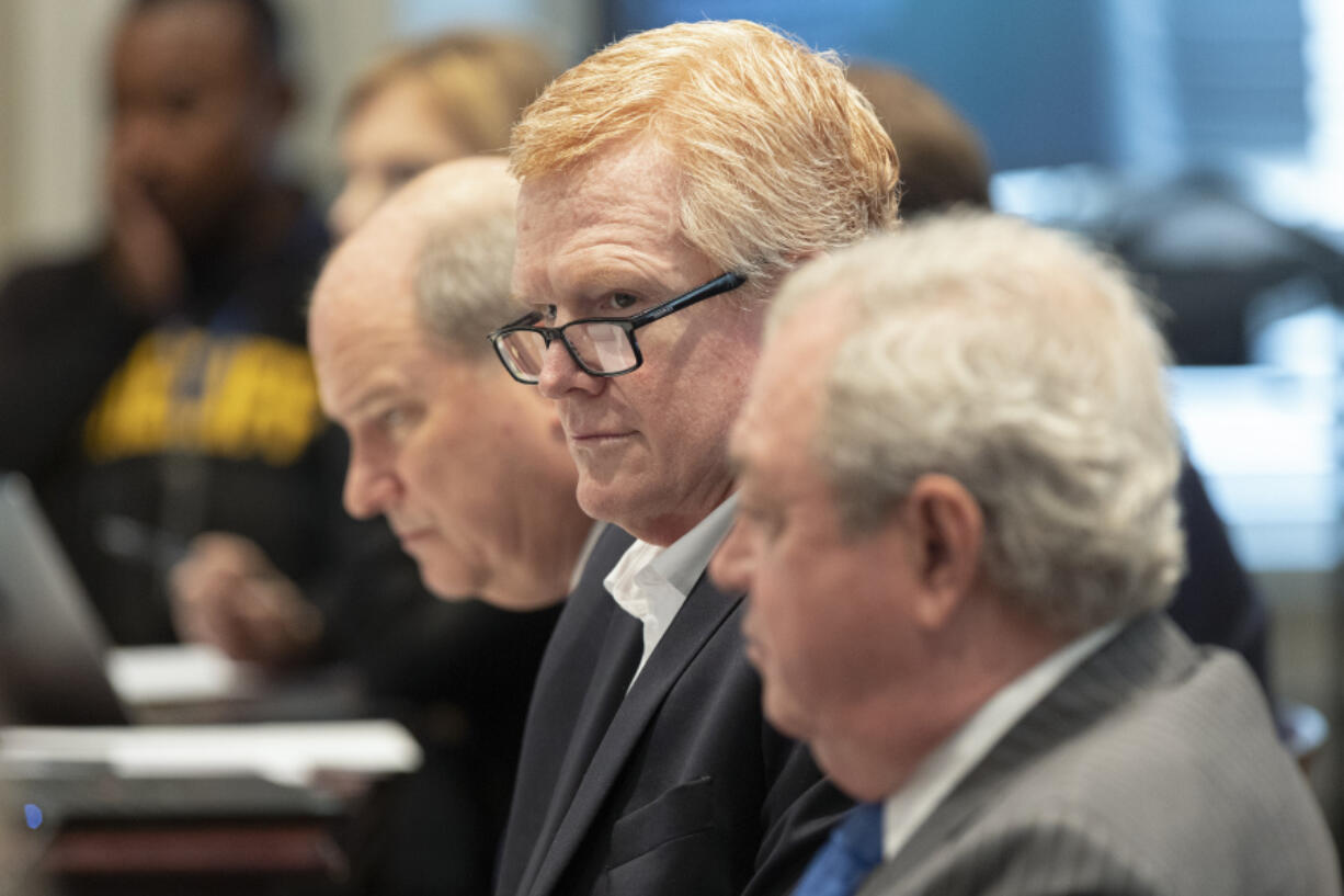 Alex Murdaugh listens as prosecutor Creighton Waters makes closing arguments during his double murder trial at the Colleton County Courthouse on Wednesday, March 1, in Walterboro, S.C. The 54-year-old attorney is standing trial on two counts of murder in the shootings of his wife and son at their Colleton County home and hunting lodge on June 7, 2021.