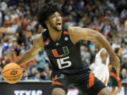 Miami forward Norchad Omier celebrates after their win against Texas in an Elite 8 college basketball game in the Midwest Regional of the NCAA Tournament Sunday, March 26, 2023, in Kansas City, Mo.