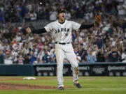 Japan pitcher Shohei Ohtani (16) celebrates after defeating the United States at the World Baseball Classic final game, Tuesday, March 21, 2023, in Miami.