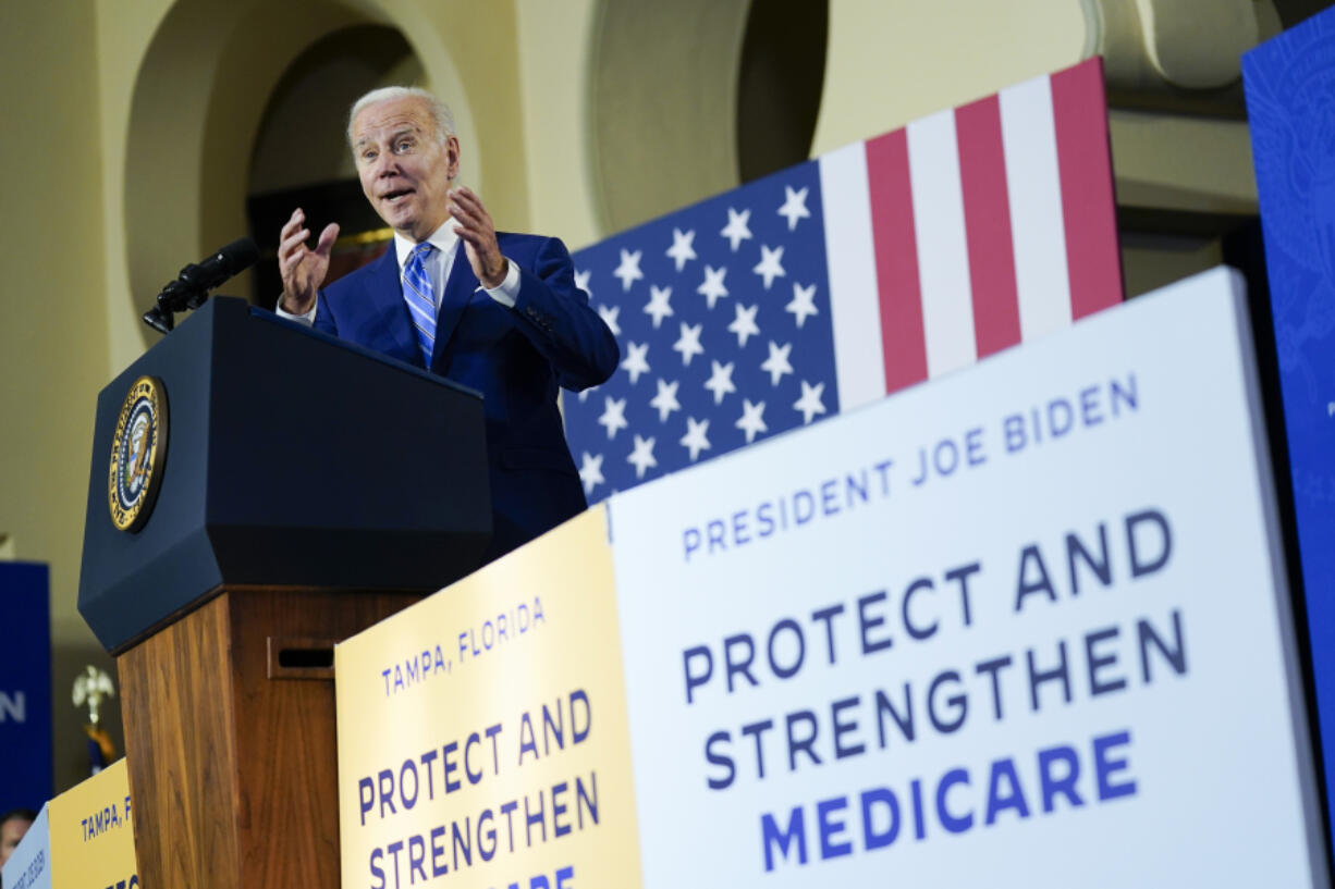 FILE - President Joe Biden speaks about his administration's plans to protect Social Security and Medicare and lower healthcare costs, Feb. 9, 2023, at the University of Tampa in Tampa, Fla. In the federal budget standoff, the majority of U.S. adults are asking lawmakers to pull off the impossible: Cut the overall size of government, but also devote more money to the most popular and expensive programs.