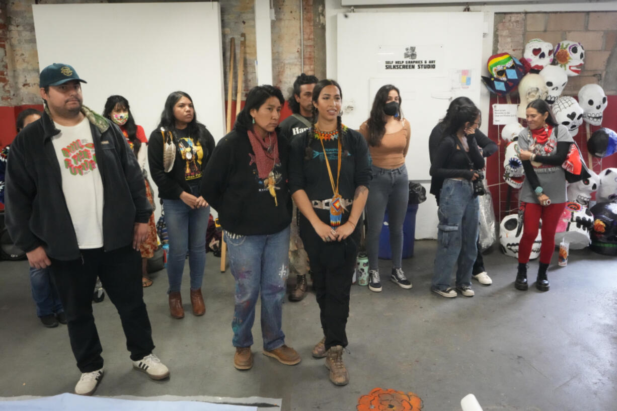 Members of the Apache Stronghold group who traveled from Arizona gather at Self Help Graphics & Art in the Los Angeles neighborhood of Boyle Heights on Monday, March 20, 2023. The Apache group battling a foreign mining firm that wants to build one of the largest copper mines in the United States on what tribal members say is sacred land will get a new chance to make its point Tuesday when a full federal appeals court panel takes another look at the case.