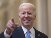 FILE - President Joe Biden talks to reporters after a lunch with Senate Democrats on his upcoming budget and political agenda, at the Capitol in Washington, Thursday, March 2, 2023. (AP Photo/J.