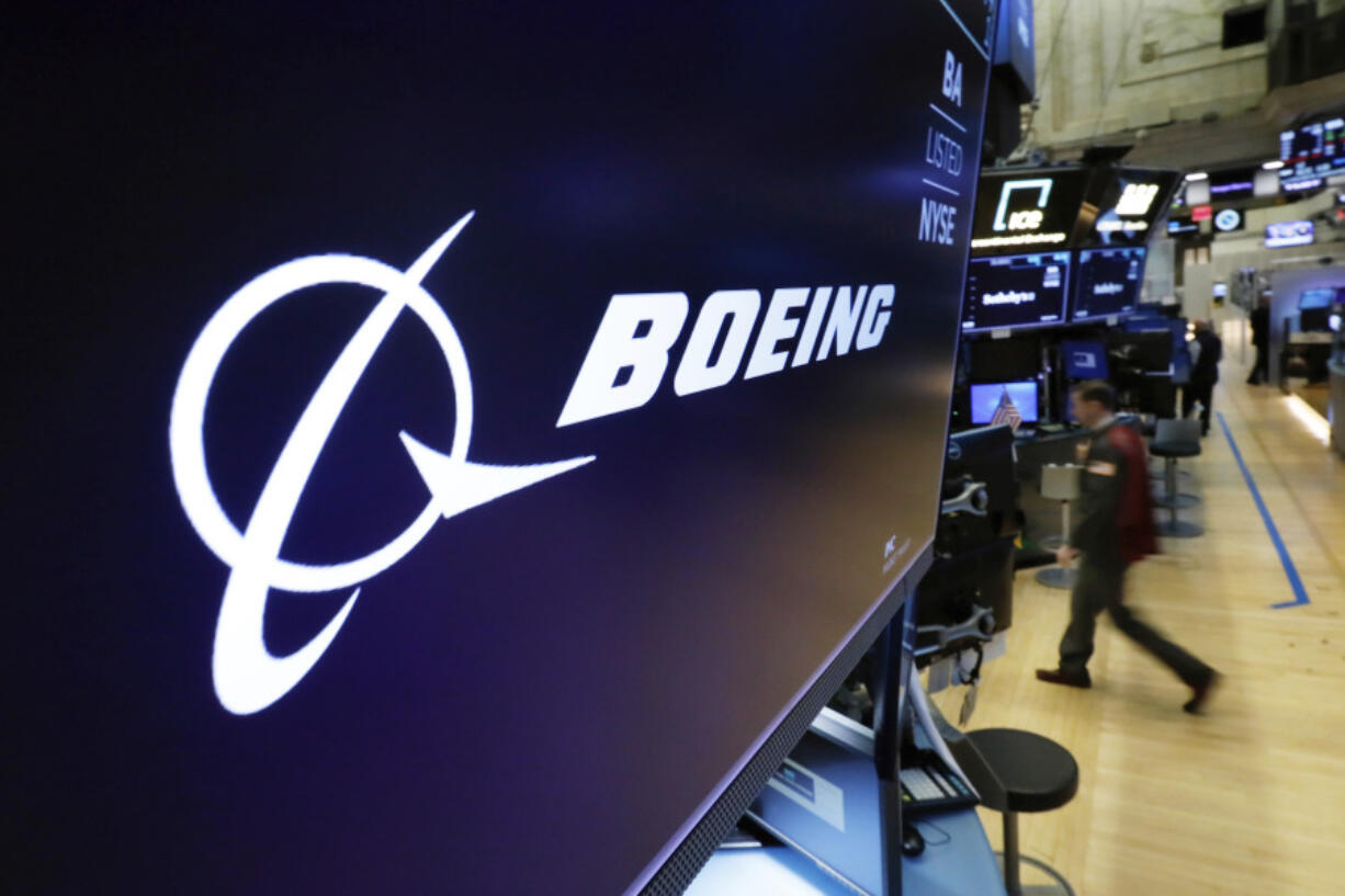 FILE - In this March 11, 2019 file photo, the Boeing logo appears above a trading post on the floor of the New York Stock Exchange. Saudi Arabia is buying up to 121 jetliners from Boeing in a big boost for the American manufacturer. The deal was expected to be announced Tuesday, March 14, 2023.