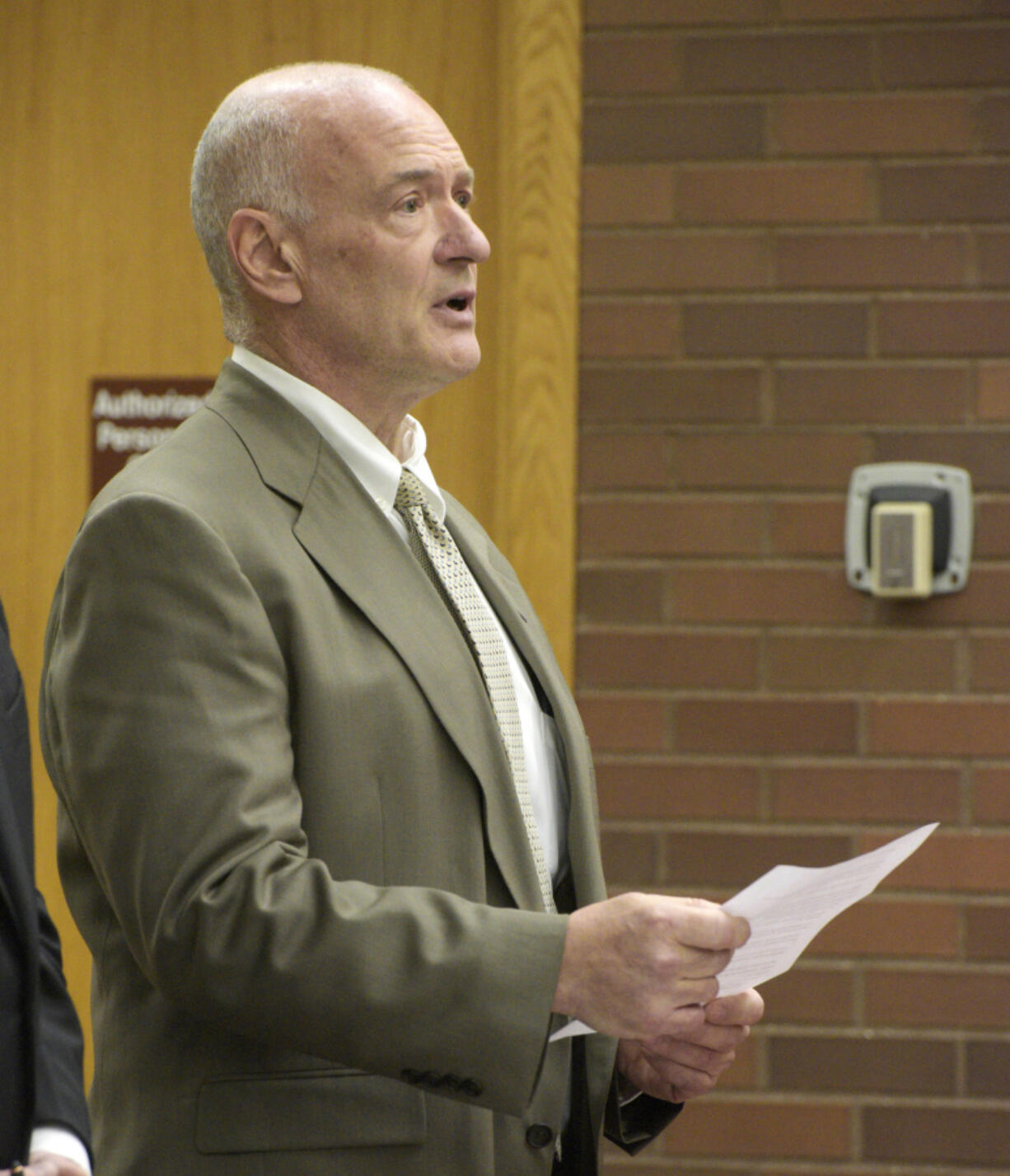 Michael Konschak reads a statement during an appearance in Danbury Superior Court Wednesday, March 1, 2023, in Danbury, Conn. Konschak, a hunter who told authorities he killed and skinned what he thought were two coyotes, but later discovered they were a Connecticut family's pet German shepherds, has been criminally charged. Konschak, 61, of Carmel, N.Y., said he was ashamed of what he did, during the hearing in Danbury Superior Court that drew dozens of people including the dogs' owners and animal rights advocates.