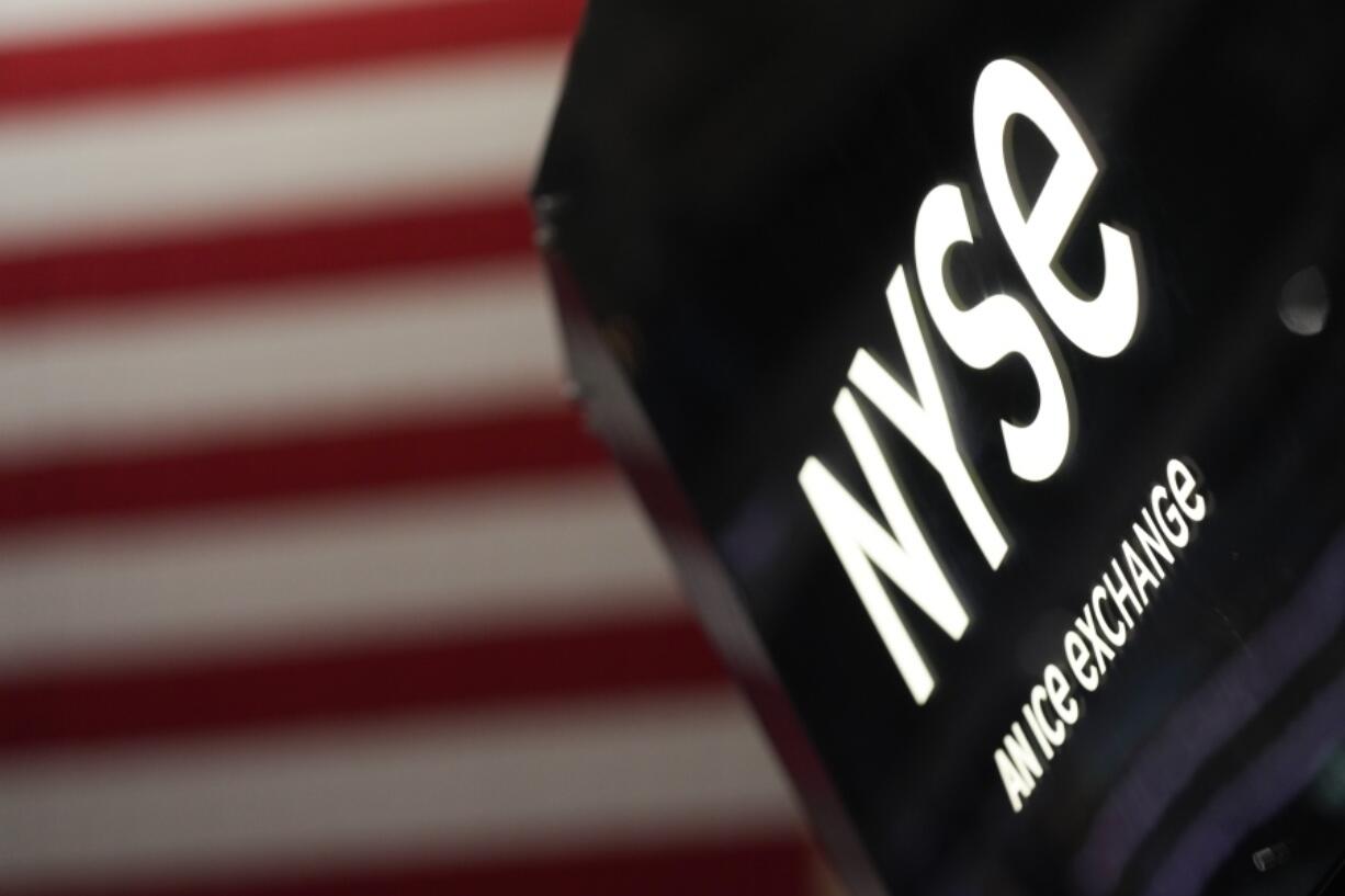 An NYSE sign is seen on the floor at the New York Stock Exchange in New York, Wednesday, Feb. 22, 2023.