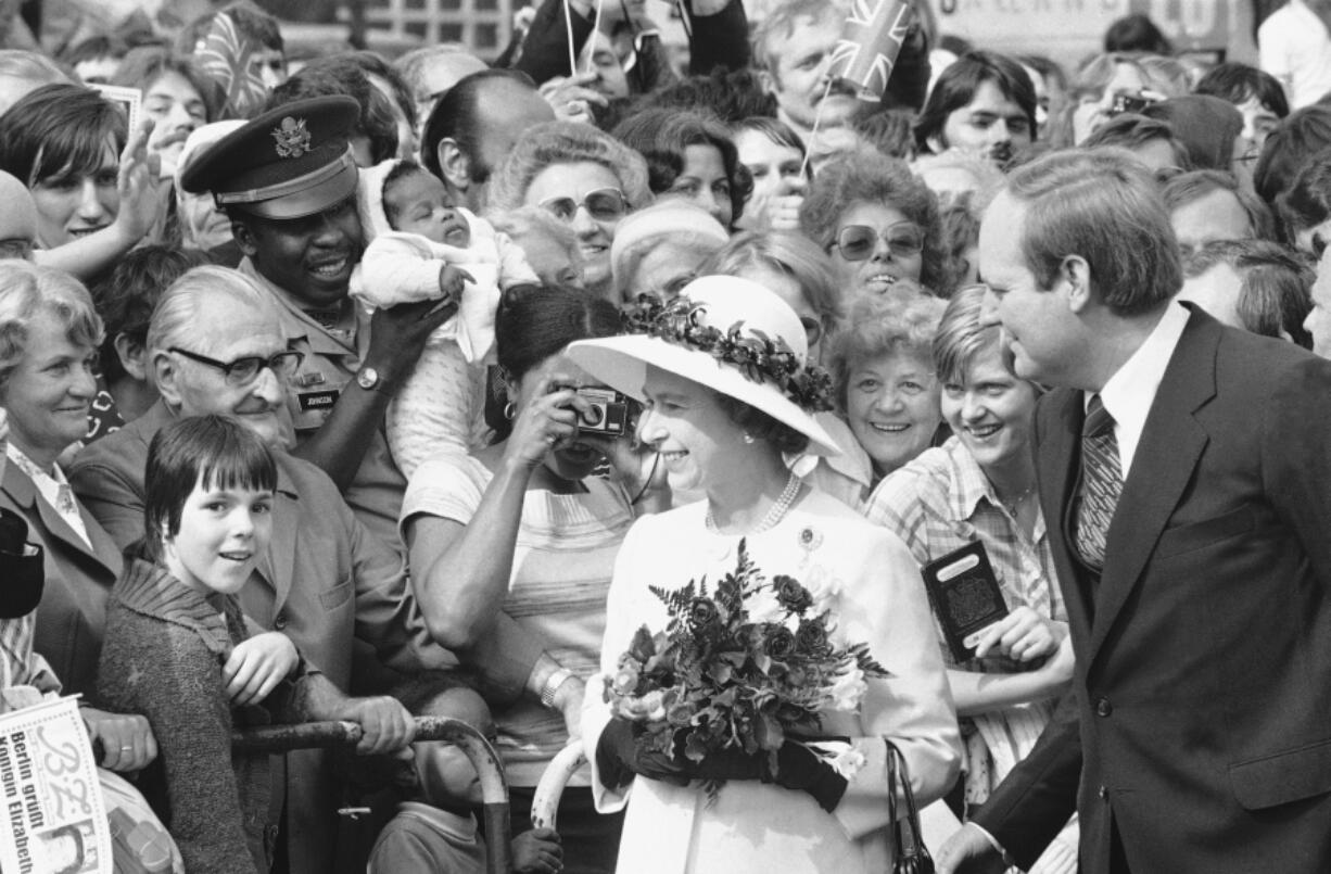 FILE - People gather to greet Britain's Queen Elizabeth II as she walked along the famous Kurfuerstendamm Boulevard in West Berlin, Germany, on May 24, 1978. One would like two horses. That, in effect, was the gift requested by Britain's Queen Elizabeth II during her state visit to Germany in 1978, weekly Der Spiegel reported Monday, March 27, 2023.