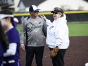 Former Heritage athletic director Leta Meyer, right, talks with Kelso coach Dean Sorenson prior to the first Heritage fastpitch softball game played at the school's new turfed field facility on Tuesday, March 14, 2023 (Tim Martinez/The Columbian)