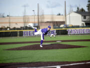 Heritage pitcher Ethan Scott delivers a pitch during the Timberwolves' first baseball game at Heritage's new turf field facility on Tuesday, March 14, 2023.