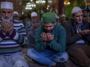 Kashmiri Muslims pray inside the shrine of Sufi saint Shiekh Abdul Qadir Jeelani on the first day of ramadan in Srinagar, Indian controlled Kashmir, Thursday, March 23, 2023. The first daily fast of the Islamic holy month of Ramadan began Thursday, as hundreds of millions of Muslims worldwide enter a four-week period of worship.