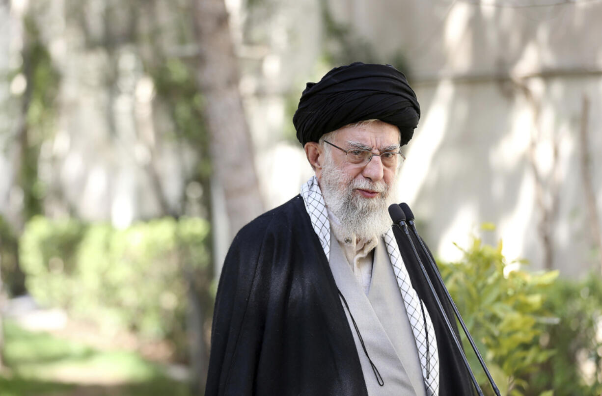 In this picture released by the official website of the office of the Iranian supreme leader, Supreme Leader Ayatollah Ali Khamenei speaks after planting a tree marking National Tree Planting Day, at the courtyard of his office in Tehran, Iran, Monday, March 6, 2023.