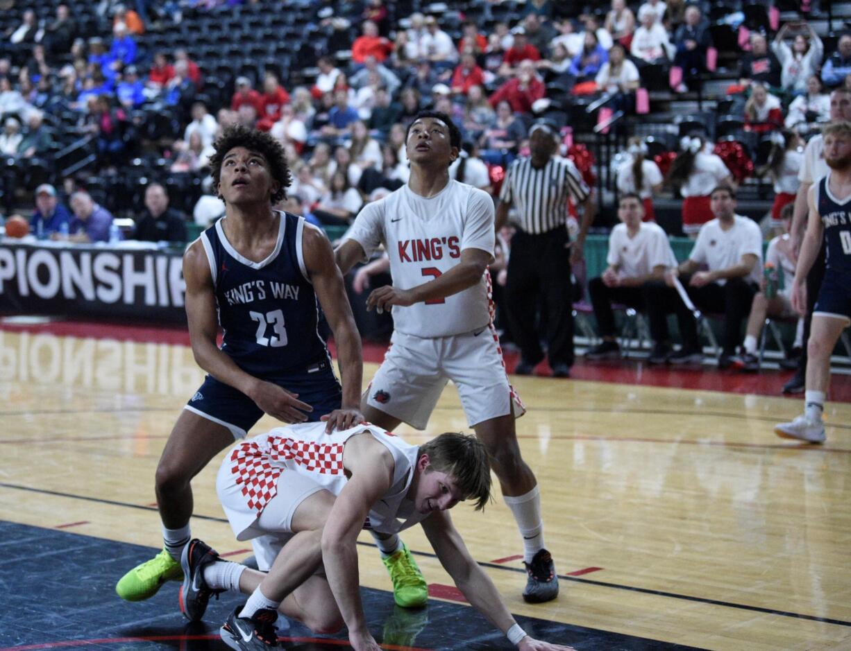 King’s Way Christian’s Jamison Duke (23) battles for a rebound against King’s during the first half of a Class 1A boys basketball state tournament game on Wednesday, March 1, 2023 in Yakima.