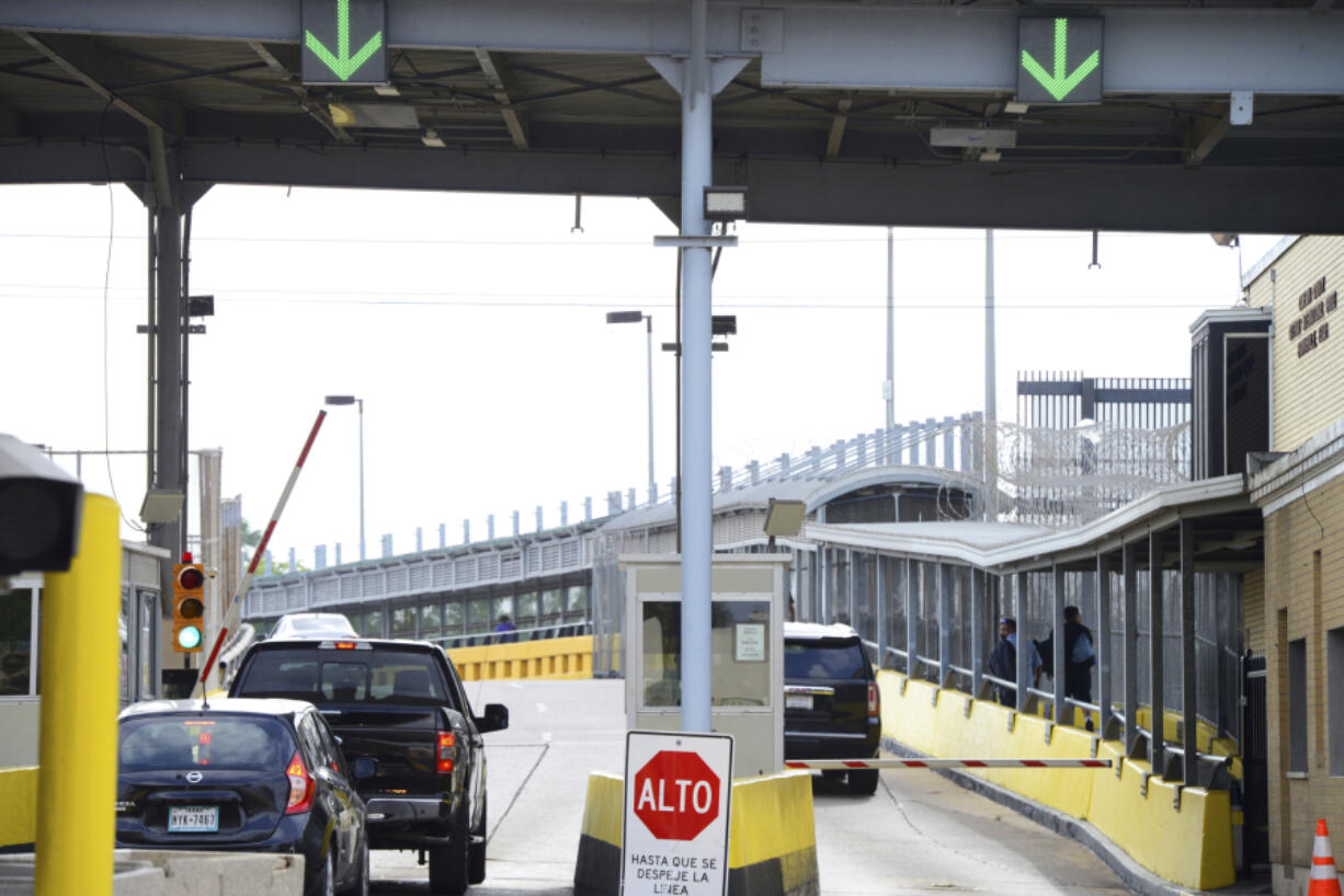 Motorists pay a bridge toll at Gateway International Bridge on Monday, March 6, 2023, in Brownsville, Texas, to cross into Matamoros, Mexico. Gunmen kidnapped four U.S. citizens who crossed into Mexico from Texas last week to buy medicine but were caught in a shootout that killed at least one Mexican citizen, U.S. and Mexican officials said Monday.