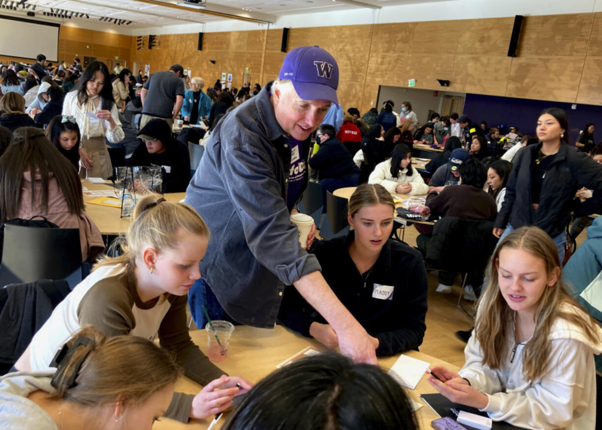 Ballard High School social studies teacher Shawn Lee talks to his students at MisinfoDay, an event hosted by the University of Washington to help high school students identify and avoid misinformation, Tuesday, March 14, 2023, in Seattle. Educators around the country are pushing for greater digital media literacy education.