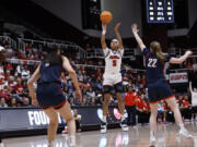 Mississippi forward Snudda Collins (5) shoots a 3-pointer against Gonzaga guard Brynna Maxwell (22) during the first half of a first-round college basketball game in the women's NCAA Tournament in Stanford, Calif., Friday, March 17, 2023.