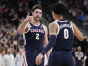 Gonzaga's Drew Timme (2) and Julian Strawther (0) celebrate in the second half of a Sweet 16 college basketball game against UCLA in the West Regional of the NCAA Tournament, Thursday, March 23, 2023, in Las Vegas.