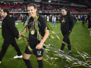 FILE - Portland Thorns FC forward Christine Sinclair (12) celebrates after the NWSL championship soccer match against the Kansas City Current, Saturday, Oct. 29, 2022, in Washington. The Portland Thorns' Christine Sinclair is one of just five players who helped launch the National Women's Soccer League in 2013 and are still with their same teams.