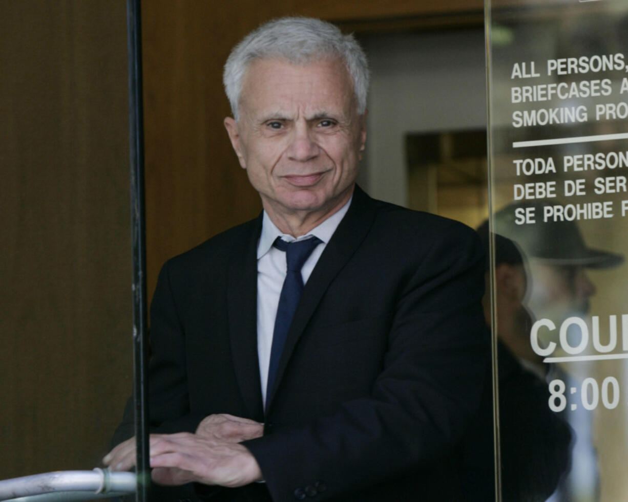 FILE - Actor Robert Blake leaves court for the lunch break, Oct. 3, 2005, after his second day of testimony in a wrongful death lawsuit, brought by the family of Bonny Lee Bakley, in Burbank, Calif. Blake, the Emmy award-winning performer who went from acclaim for his acting to notoriety when he was tried and acquitted of murdering his wife, died Thursday, March 9, 2023, at age 89.