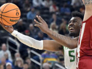 Oregon guard Jermaine Couisnard (5) drives to the basket against Washington State during the second half of an NCAA college basketball game in the quarterfinals of the Pac-12 men's tournament Thursday, March 9, 2023, in Las Vegas.