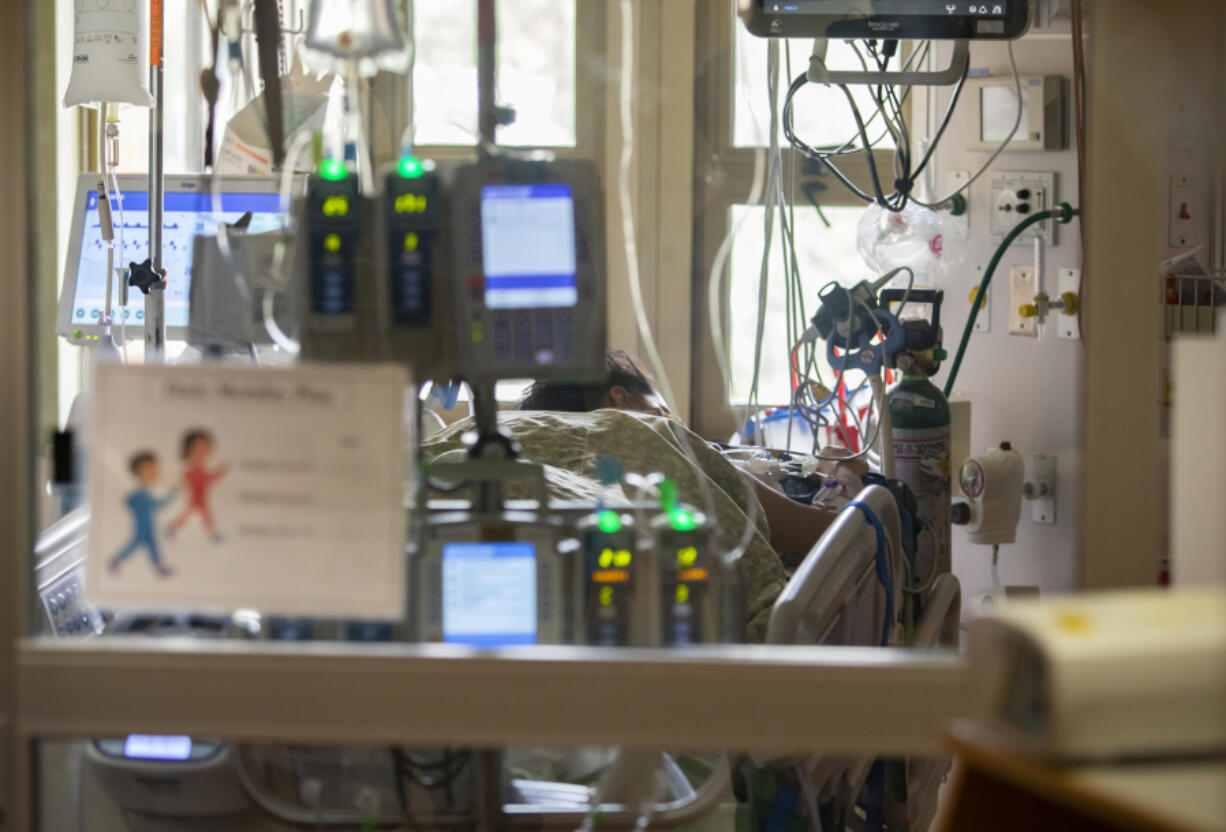 FILE - A pregnant and intubated COVID-19 patient lies in the Surgical Intensive Care Unit in a hospital in Boise, Idaho, on Tuesday, Aug. 31, 2021. More than 1,200 U.S. women died in 2021 during pregnancy or shortly after childbirth, according to a final tally released Thursday, March 16, 2023, by the Centers for Disease Control and Prevention. COVID-19 can be particularly dangerous to pregnant women, and experts believe it was the main reason for the 2021 spike.