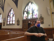 FILE - The Rev. Manuel Rodriguez sits in the pews of his church, Our Lady of Sorrows, on March 5, 2021, in the Queens borough of New York. A new survey by the Pew Research Center, Tuesday, March 28, 2023, says in-person attendance at religious services in the U.S. declined during the COVID-19 pandemic. But Rodriguez says attendance is now higher at his Catholic church than before the pandemic, even though more than 100 of his parishioners died of COVID.