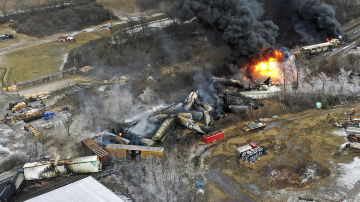 FILE - This photo taken with a drone shows portions of a Norfolk Southern freight train that derailed Feb. 3, in East Palestine, Ohio, are still on fire on Feb. 4, 2023.   (AP Photo/Gene J.