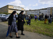 Two nuns walk in front of the Agostino Gemelli University Hospital in Rome, Thursday, March 30, 2023, where Pope Francis was admitted on Wednesday after having suffered breathing problems in recent days and was diagnosed with a respiratory infection.