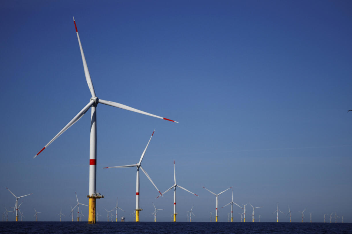 FILE - Wind turbines work at the Saint-Nazaire offshore wind farm, off the coast of the Guerande peninsula in western France, on Sept. 22, 2022. The wind power industry on Monday, March 27, 2023, projected growth to rapidly accelerate this year, with incentives and policy changes in key nations helping to overcome factors that led to a slowdown in 2022.