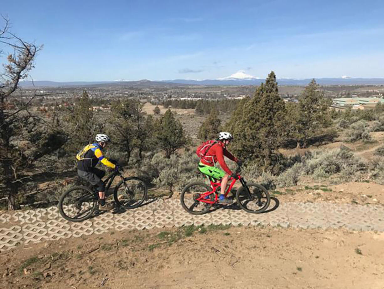 Bend, Oregon's Mark Johnson, left, and Andrew Williams ride concrete pavers on the west side of the Madras East Hills trail network.