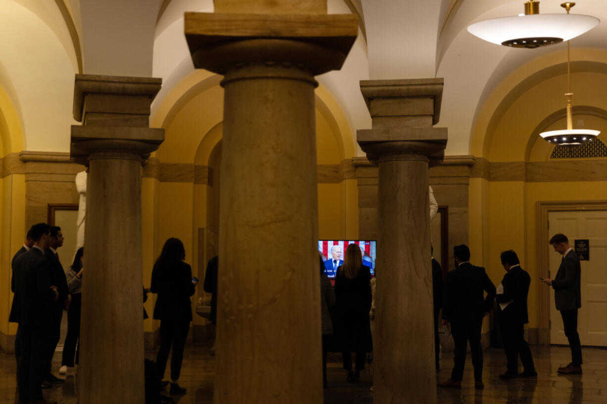 Congressional staffers watch U.S. President Joe Biden deliver his State of the Union address in the U.S. Capitol on Feb. 7, 2023, in Washington, D.C. The speech marks Biden's first address to the new Republican-controlled House.