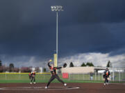 Battle Ground senior Rylee Rehbein pitches underneath dark clouds Wednesday, April 12, 2023, during the Tigers??? 4-0 loss to Skyview at Fort Vancouver High School.